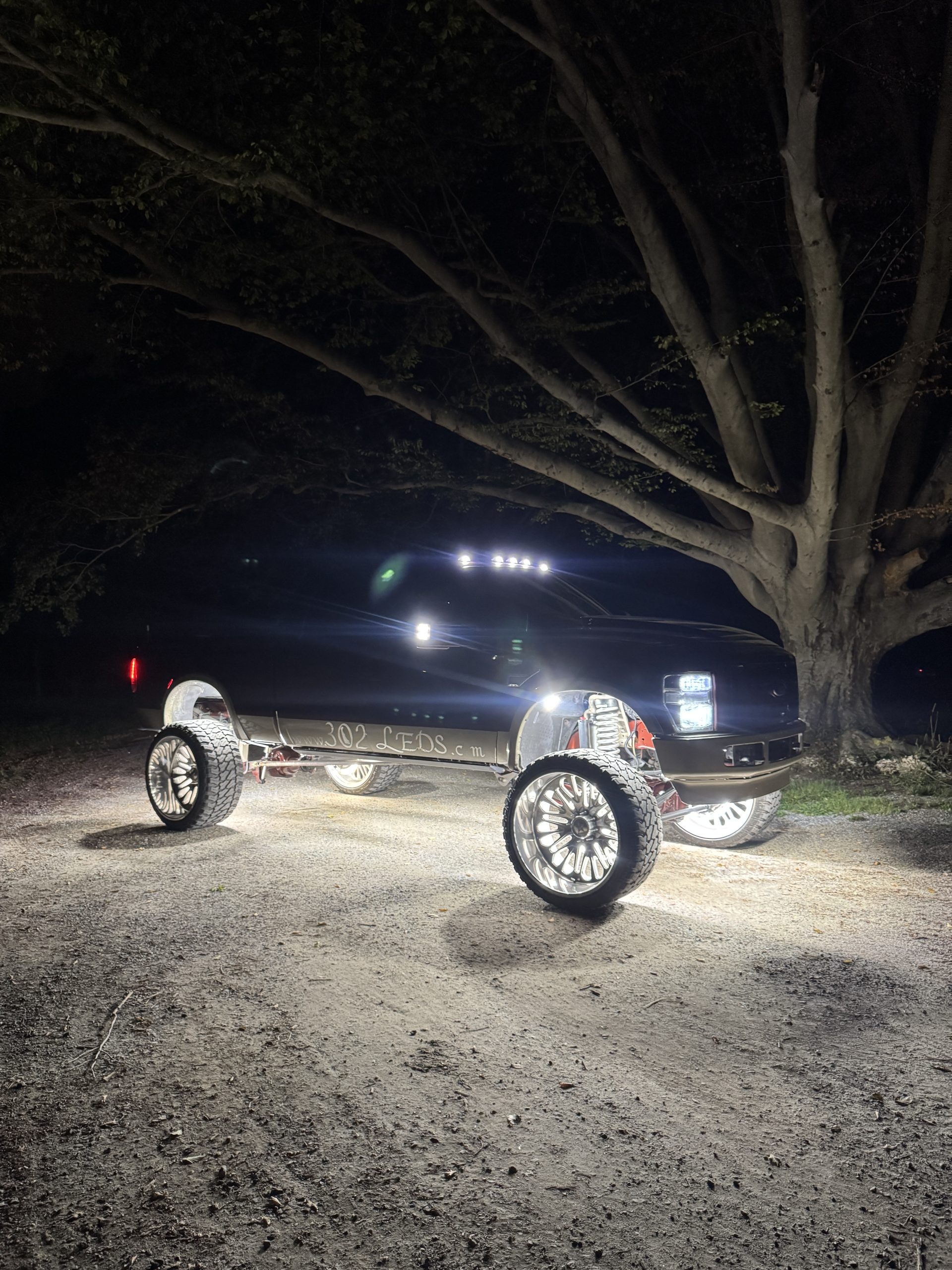 Trail lit by rock lights, night meet